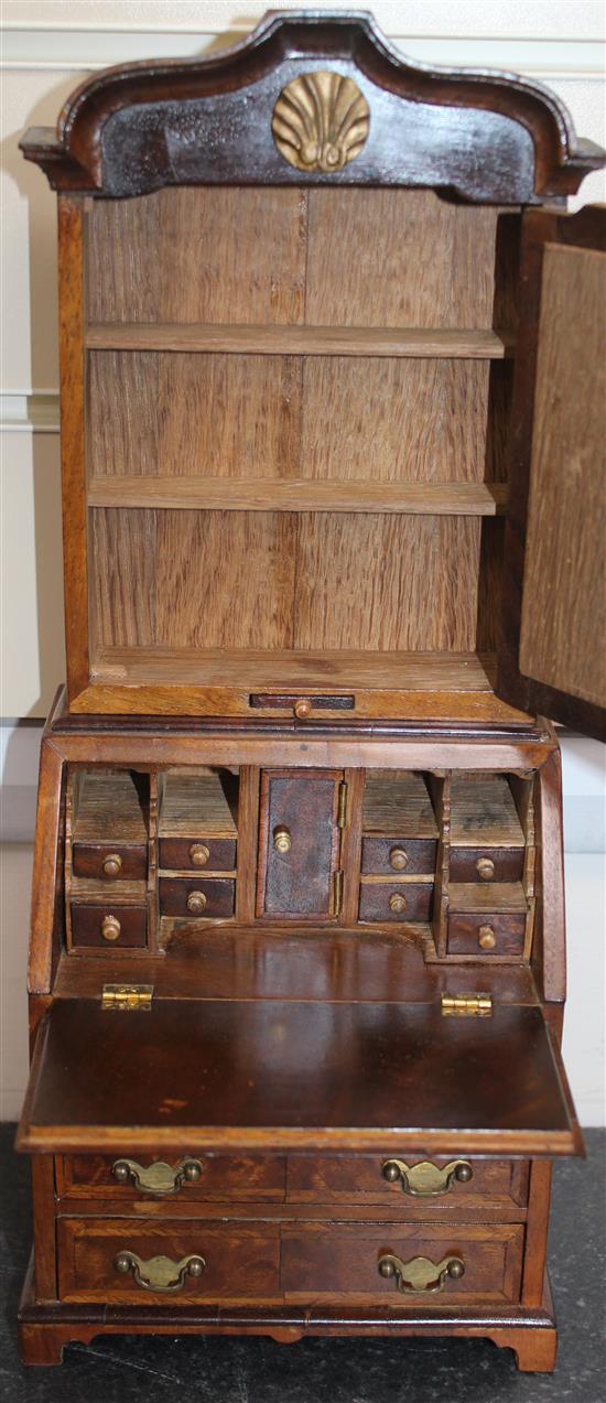 A Fergus Lane miniature 18th century style walnut bookcase,